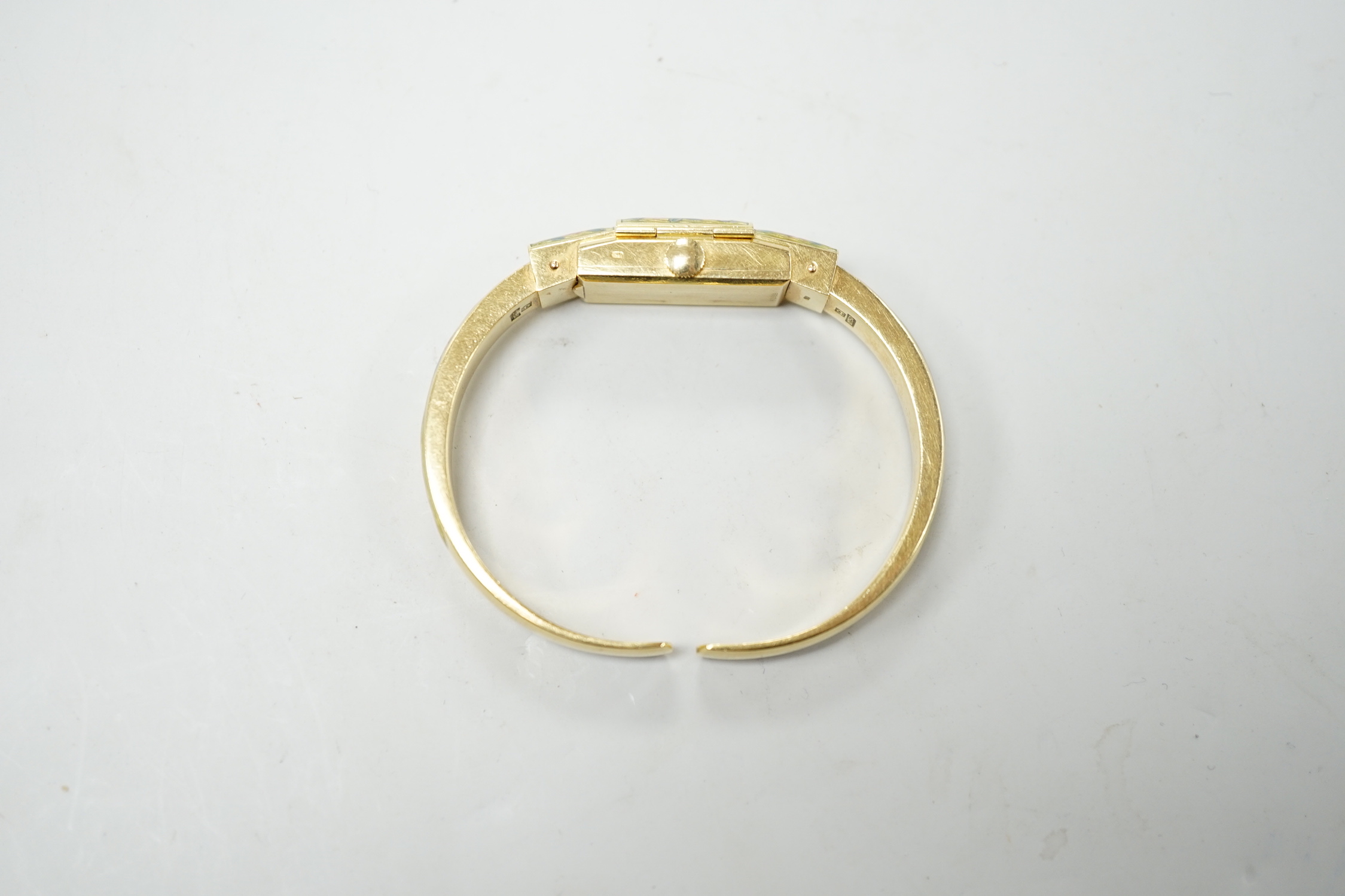 A lady's 750 and enamel Golay Stahl manual wind bangle watch, interior diameter 48mm, gross weight 22.6 grams.
